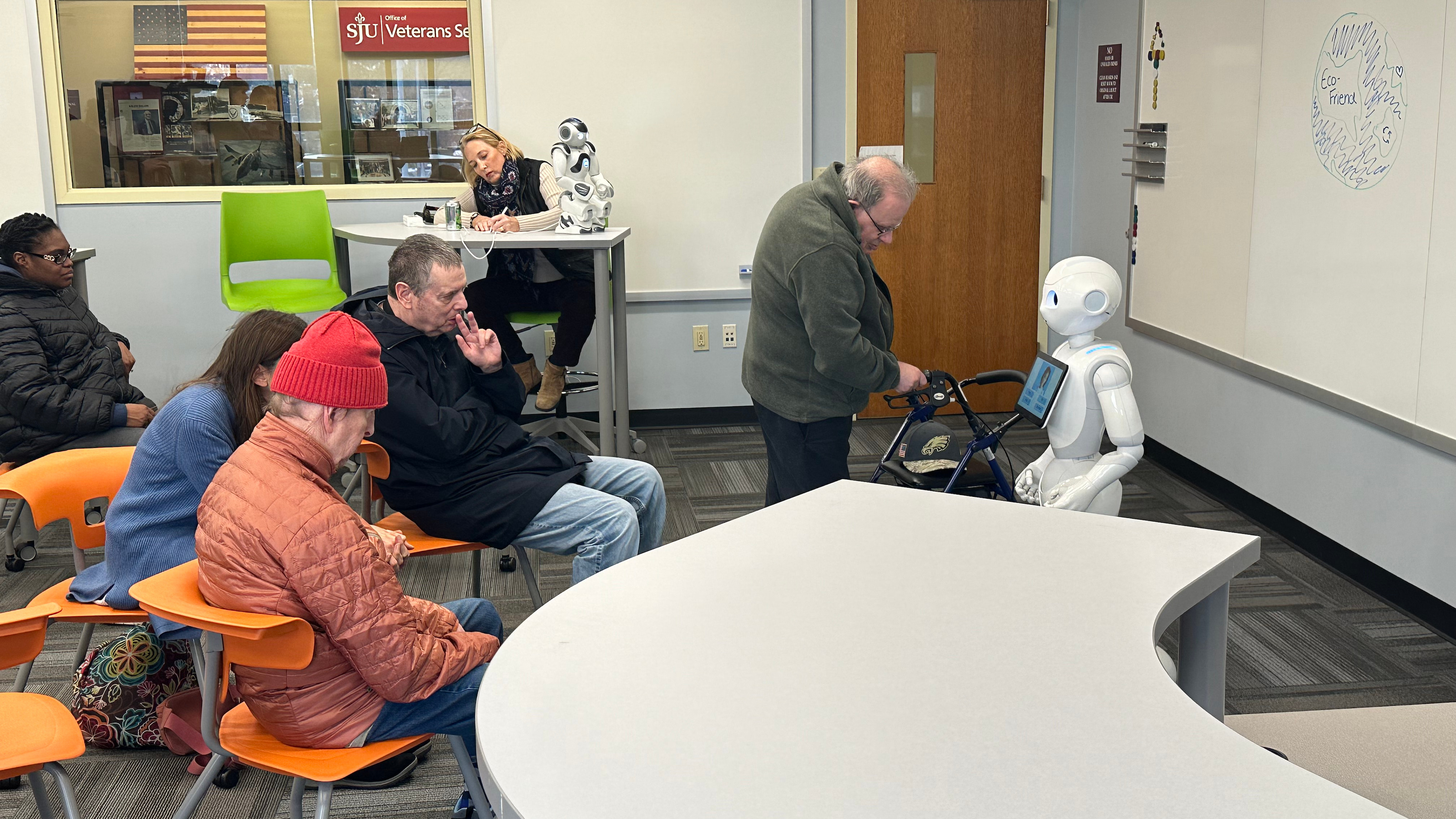 Bancroft residents interacting with Iggy during a visit to the Haub Innovation Center on Dec. 8.