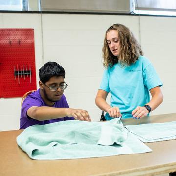 Student working with an autism student